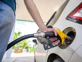 person pumping petrol