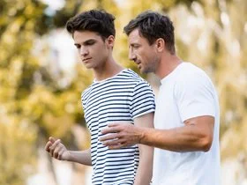 dad and son walking and talking